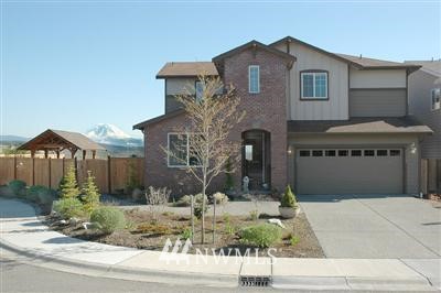 25527 Southeast 275th Place Maple Valley, WA 98038 - Photo 1 of 20 a front view of a house with garden