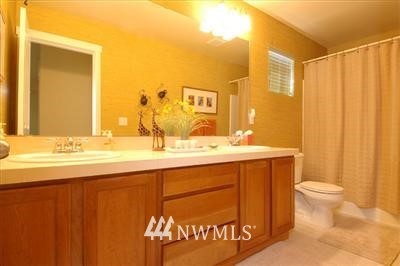 25527 Southeast 275th Place Maple Valley, WA 98038 - Photo 11 of 20 a bathroom with a sink and a mirror