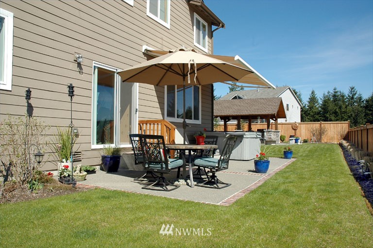25527 Southeast 275th Place Maple Valley, WA 98038 - Photo 17 of 20 a view of a house with backyard porch and sitting area