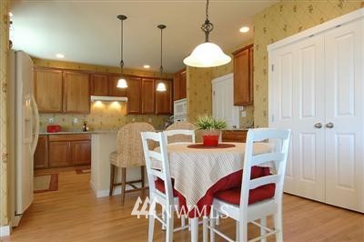 25527 Southeast 275th Place Maple Valley, WA 98038 - Photo 6 of 20 a view of a dining room with furniture