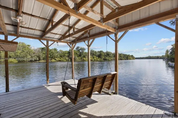 a view of a lake with sitting area
