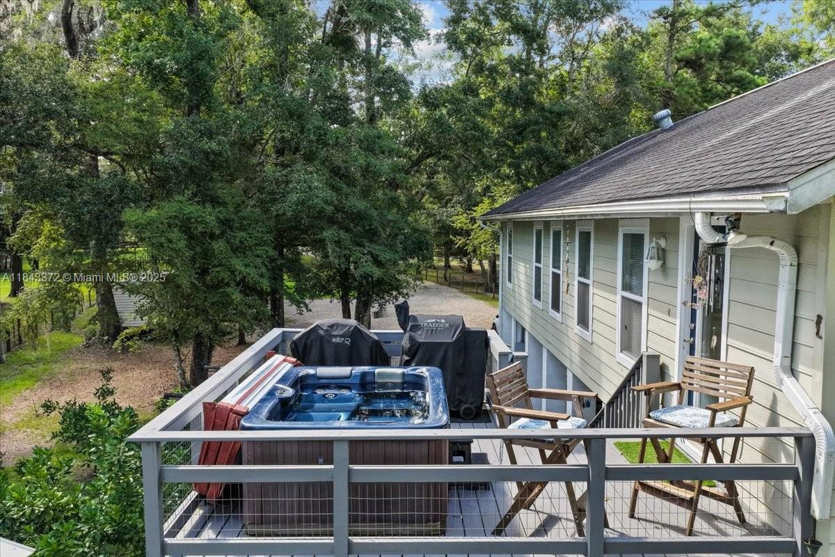 2159 Northwest 82nd Terrace Bell, FL 32619 - Photo 23 of 48 a front view of house with deck and yard