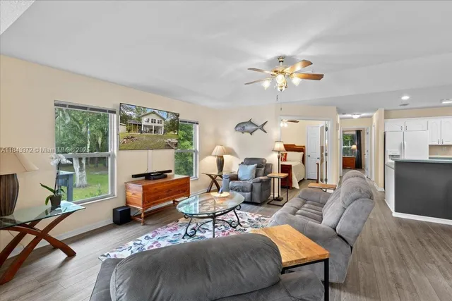a living room with furniture and a large window