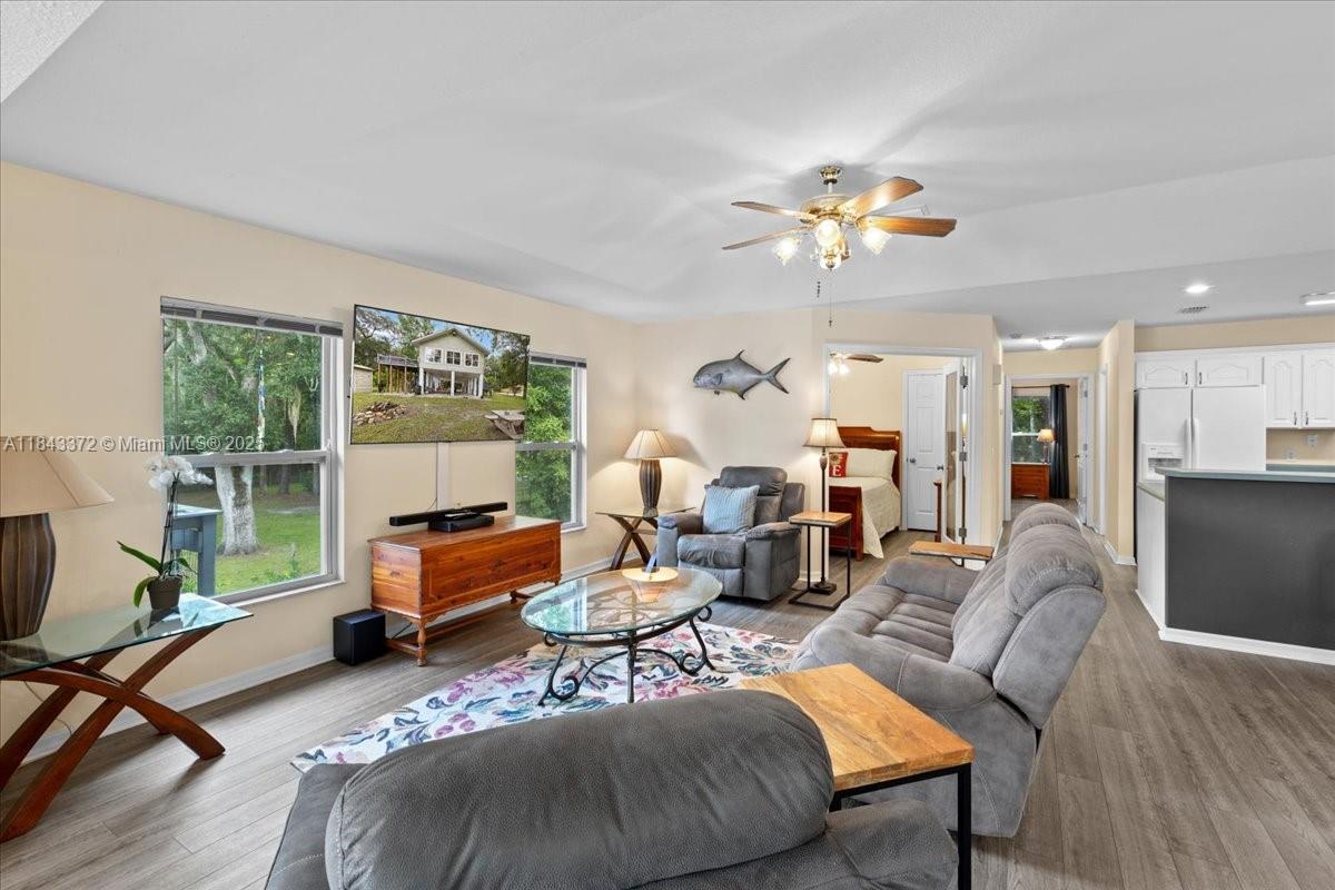 2159 Northwest 82nd Terrace Bell, FL 32619 - Photo 29 of 48 a living room with furniture and a large window