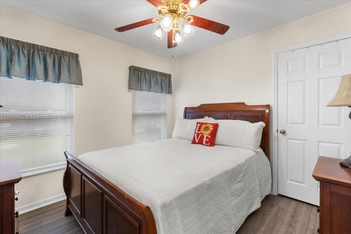 2159 Northwest 82nd Terrace Bell, FL 32619 - Photo 34 of 48 a bedroom with a bed and a chandelier