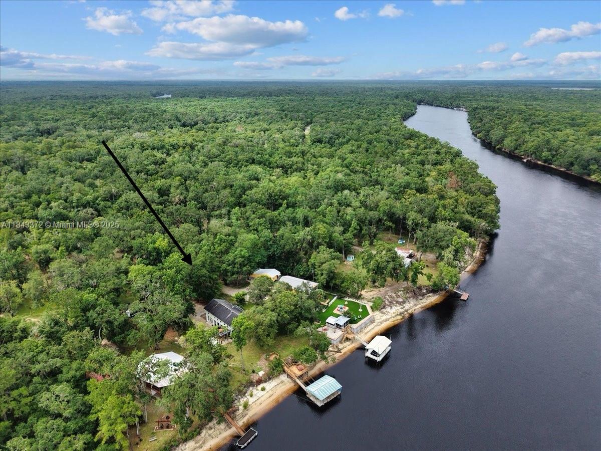 2159 Northwest 82nd Terrace Bell, FL 32619 - Photo 42 of 48 a view of a garden with an outdoor space