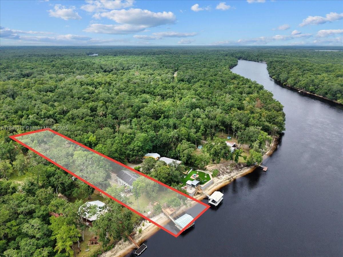 2159 Northwest 82nd Terrace Bell, FL 32619 - Photo 43 of 48 a view of a garden with an outdoor space