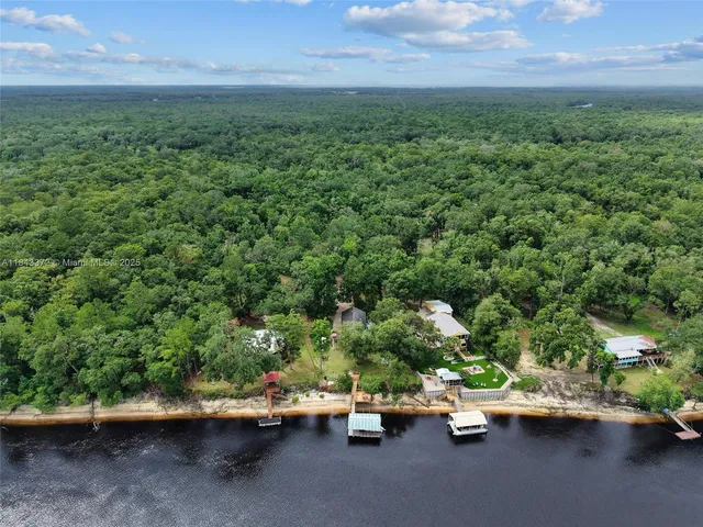 a view of outdoor space with deck and yard