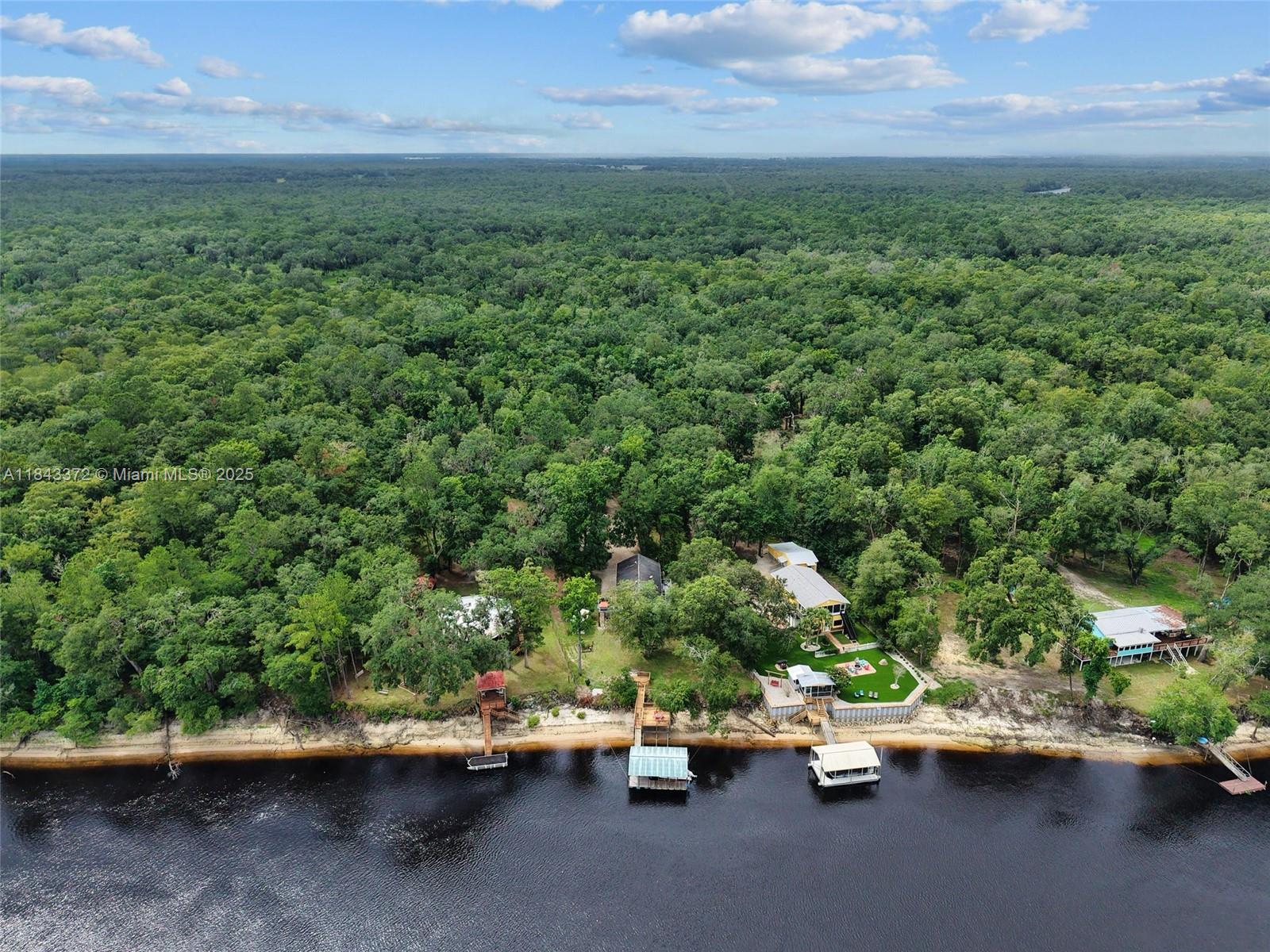 2159 Northwest 82nd Terrace Bell, FL 32619 - Photo 45 of 48 a view of outdoor space with deck and yard
