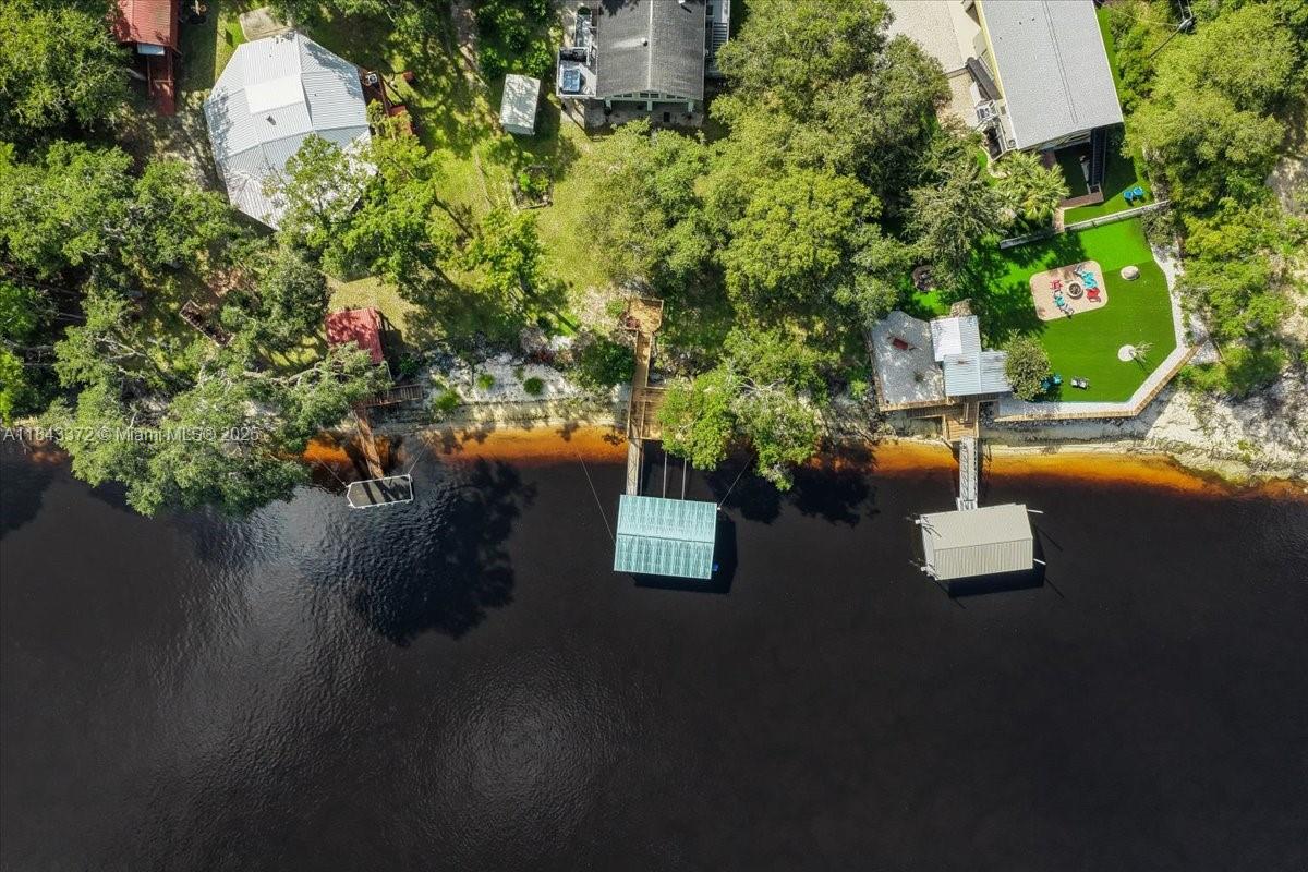 2159 Northwest 82nd Terrace Bell, FL 32619 - Photo 46 of 48 an aerial view of a house with a yard