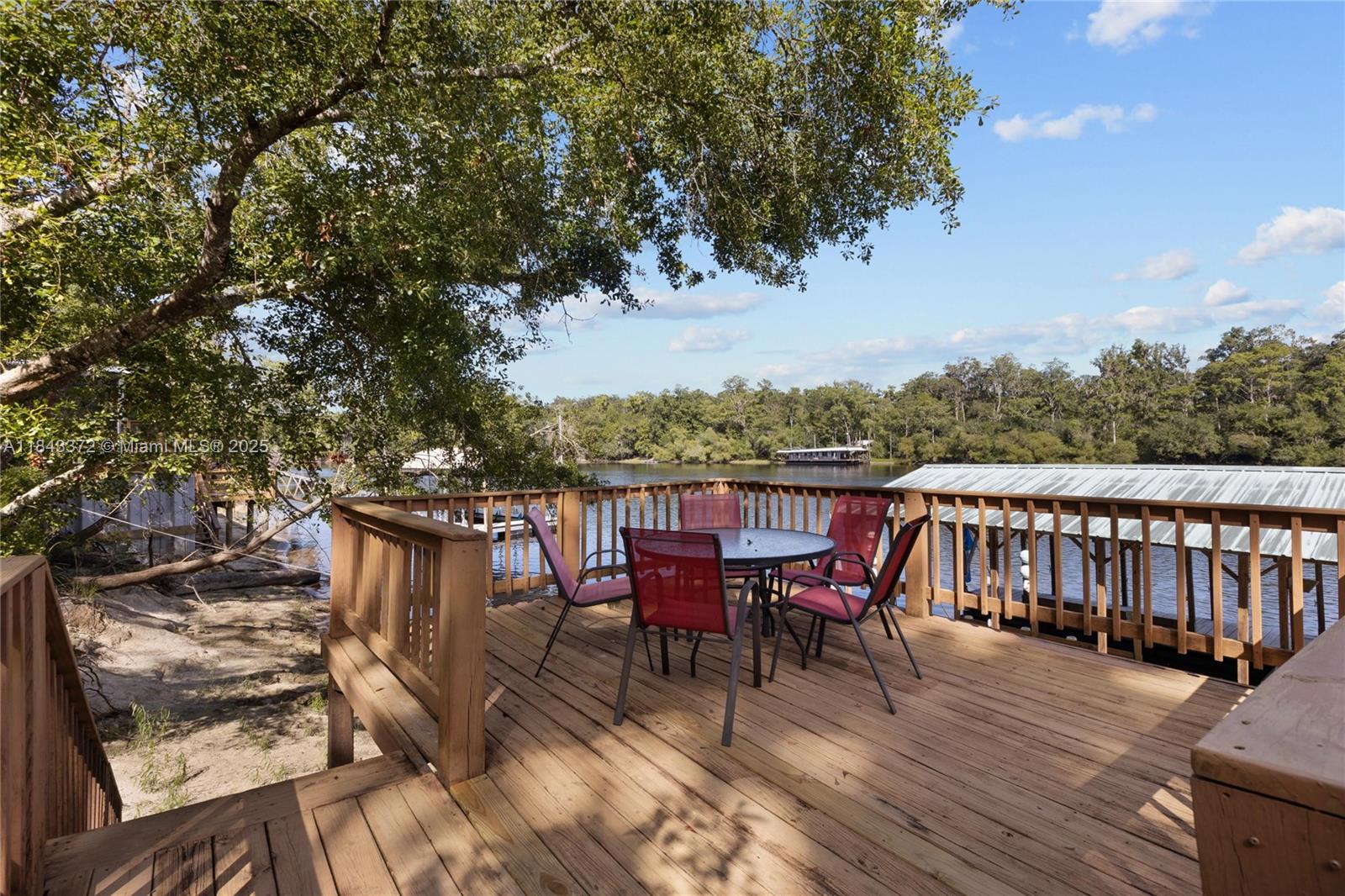 2159 Northwest 82nd Terrace Bell, FL 32619 - Photo 5 of 48 a view of a chairs and table on the wooden floor