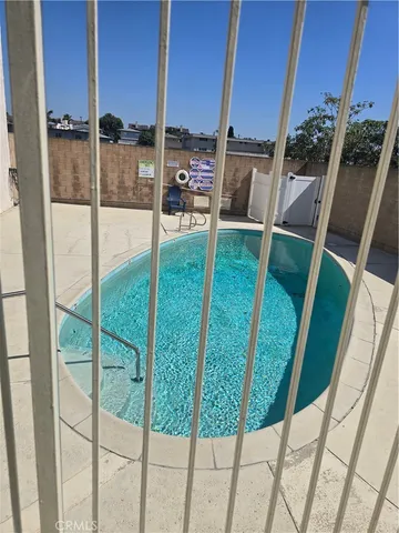 a view of swimming pool from a balcony