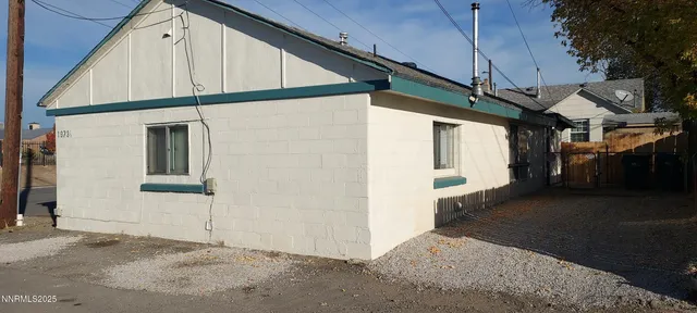 a view of a back yard of the house