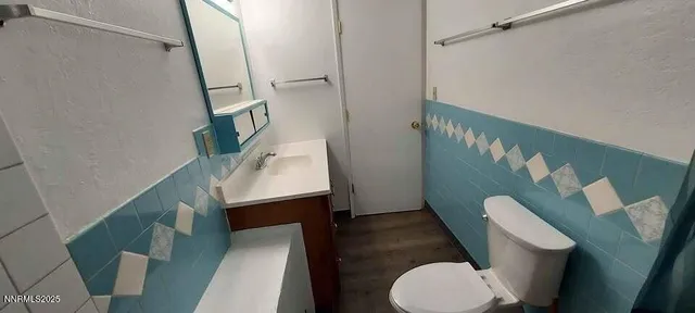 a bathroom with a toilet and a sink