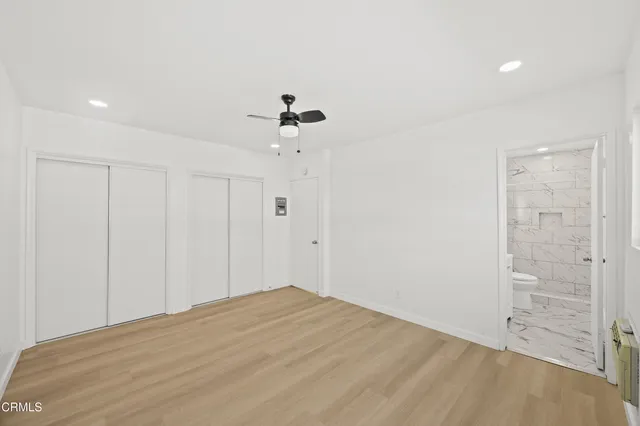 a view of a room has a bed and a chandelier