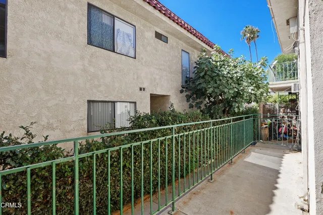 a view of a balcony with a pot