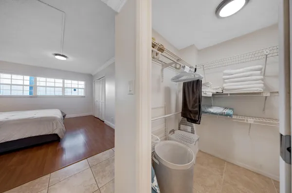 a en suite bathroom with a toilet sink and mirror
