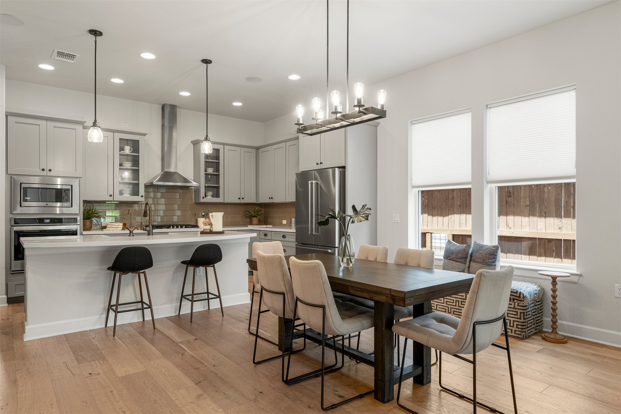4313 Vaughan Street Austin, TX 78723 - Photo 12 of 39 The dining space flows effortlessly between the kitchen and living area, defined by the same beautiful white oak hardwoods found throughout the home