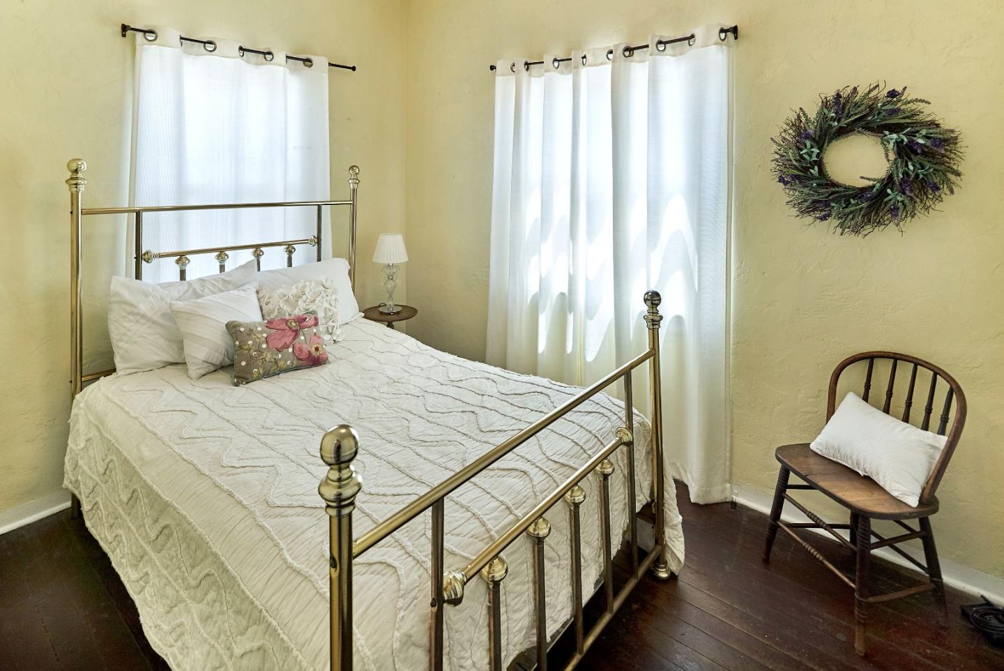 205 View Street Mountain View, CA 94041 - Photo 16 of 30 a bedroom with a bed and window