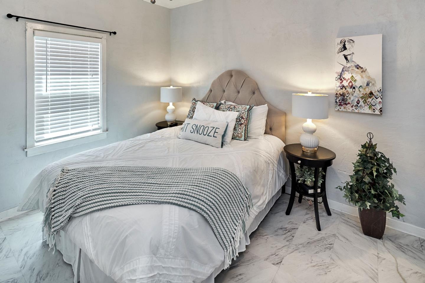 205 View Street Mountain View, CA 94041 - Photo 18 of 30 a spacious bedroom with a bed and a chandelier