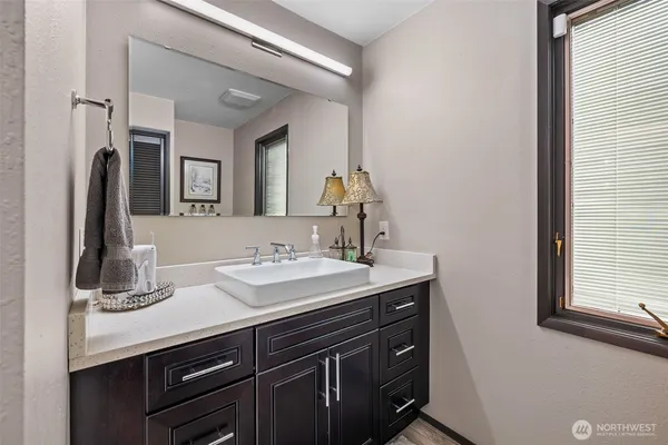 a bathroom with a sink and a mirror