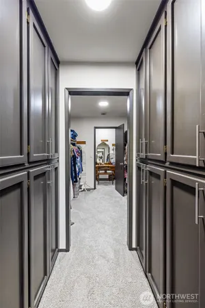 a bedroom with a bed and a large mirror