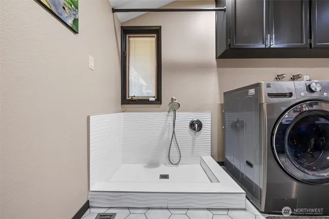 a view of a backyard with floor to ceiling window and yard