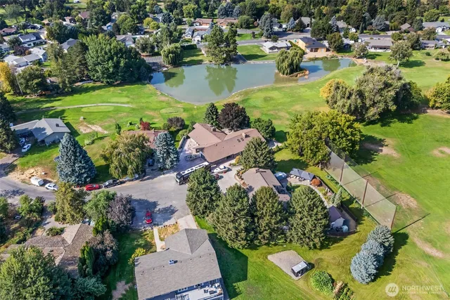 an aerial view of a houses with a lake view