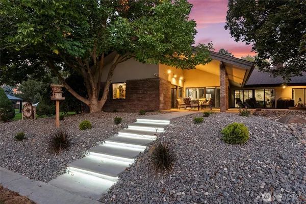 a front view of a house with garden