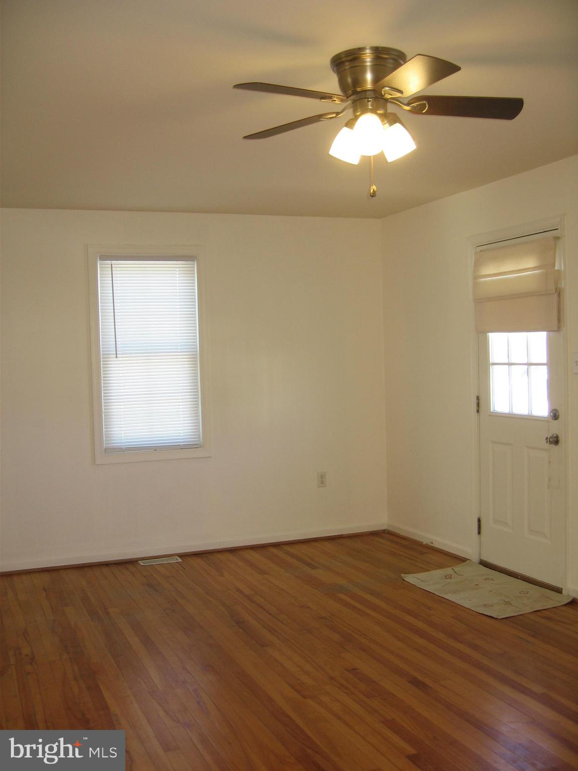 121 West 7th Avenue Ranson, WV 25438 - Photo 2 of 16 Living Room w/ Ceiling Fan