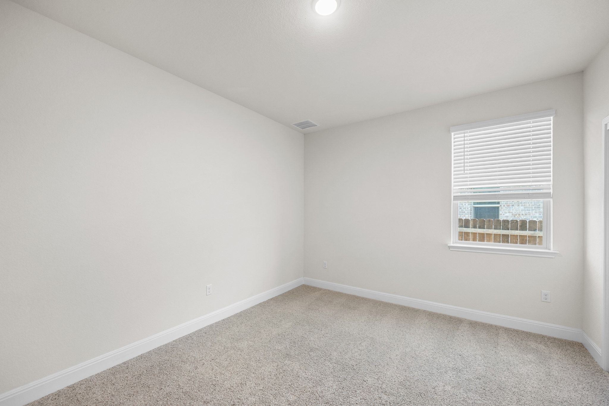 16804 Guido Cove Pflugerville, TX 78660 - Photo 20 of 38 Unfurnished room with light colored carpet and baseboards