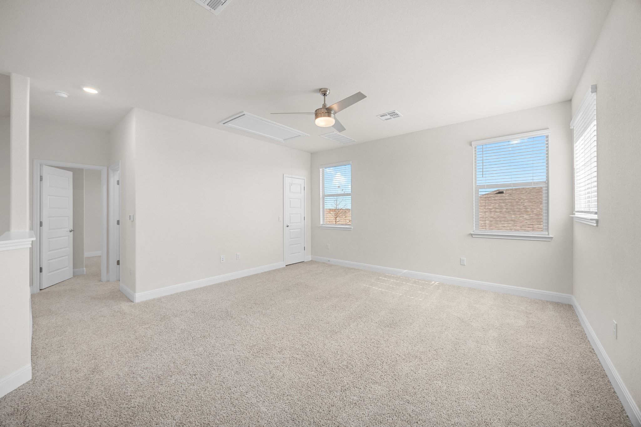 16804 Guido Cove Pflugerville, TX 78660 - Photo 21 of 38 Unfurnished room featuring light carpet and a ceiling fan