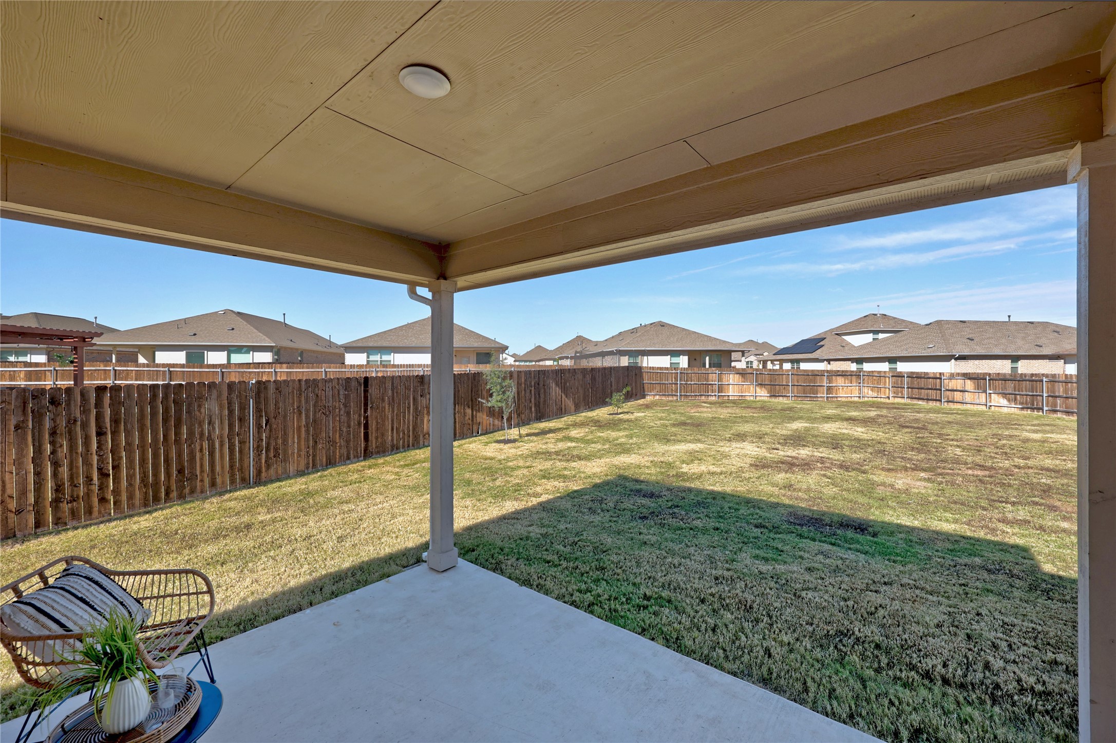 16804 Guido Cove Pflugerville, TX 78660 - Photo 27 of 38 Fenced backyard with a residential view and a patio