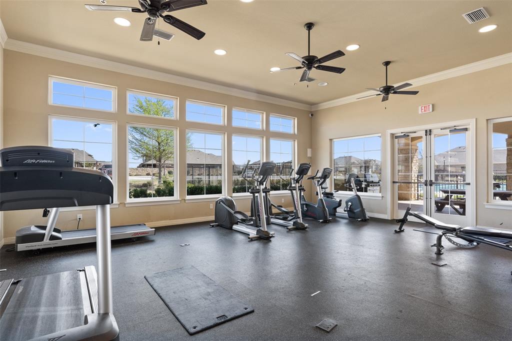 16804 Guido Cove Pflugerville, TX 78660 - Photo 32 of 38 Exercise room with crown molding, a ceiling fan, and recessed lighting