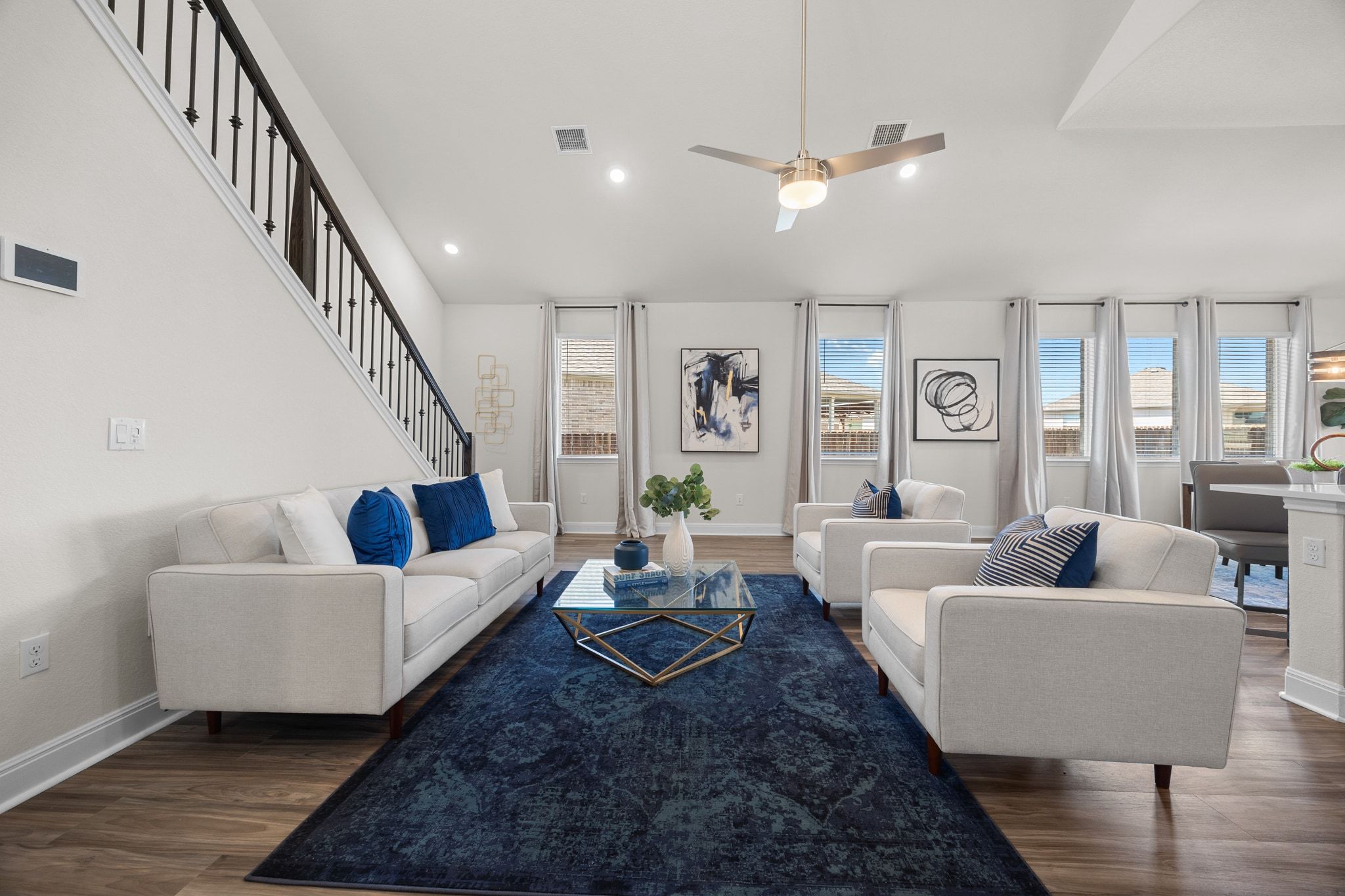 16804 Guido Cove Pflugerville, TX 78660 - Photo 8 of 38 Living room featuring recessed lighting, dark wood finished floors, lofted ceiling, ceiling fan, and stairs