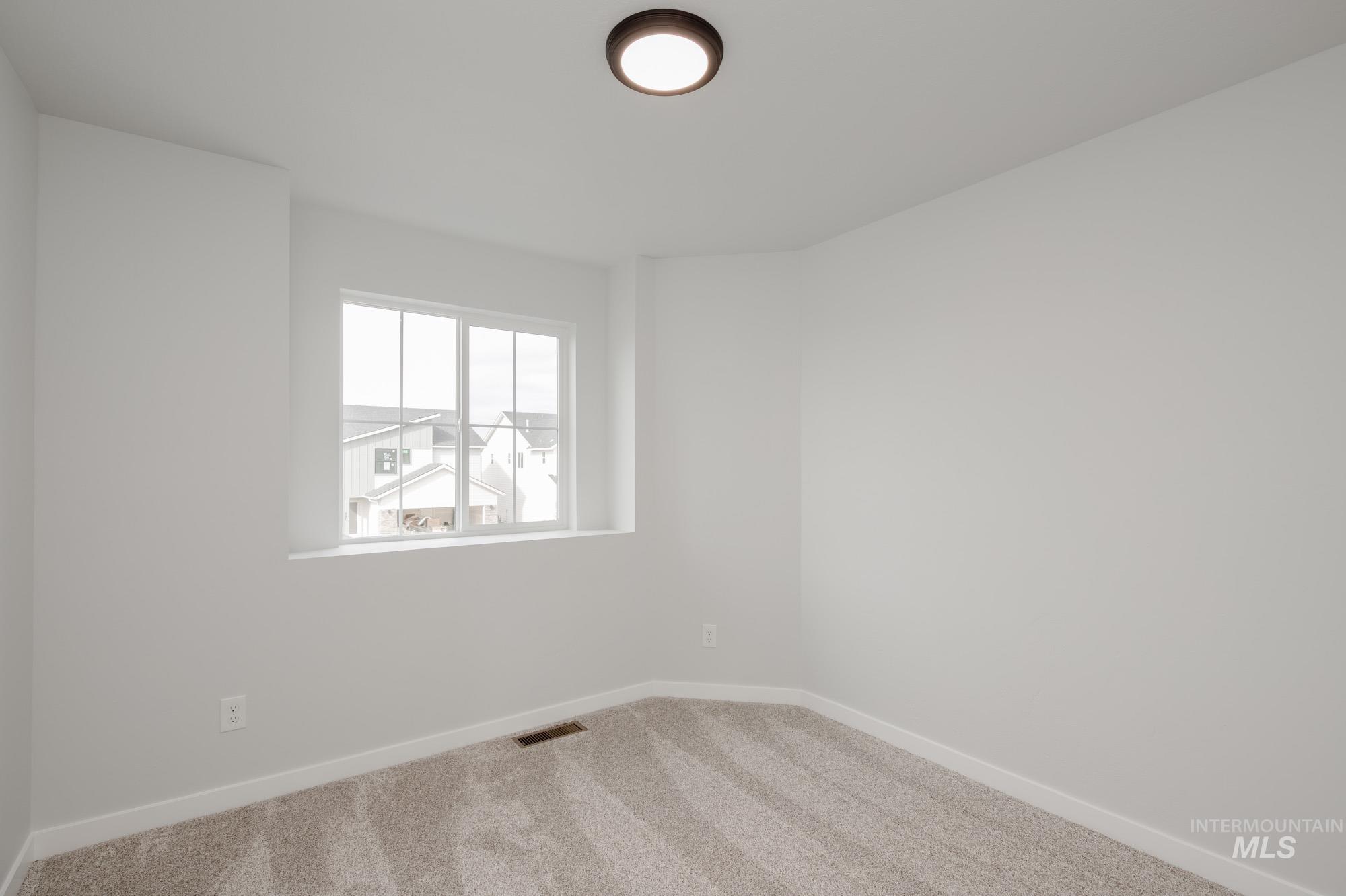 2192 South Border Way Meridian, ID 83642 - Photo 12 of 22 Carpeted empty room featuring baseboards