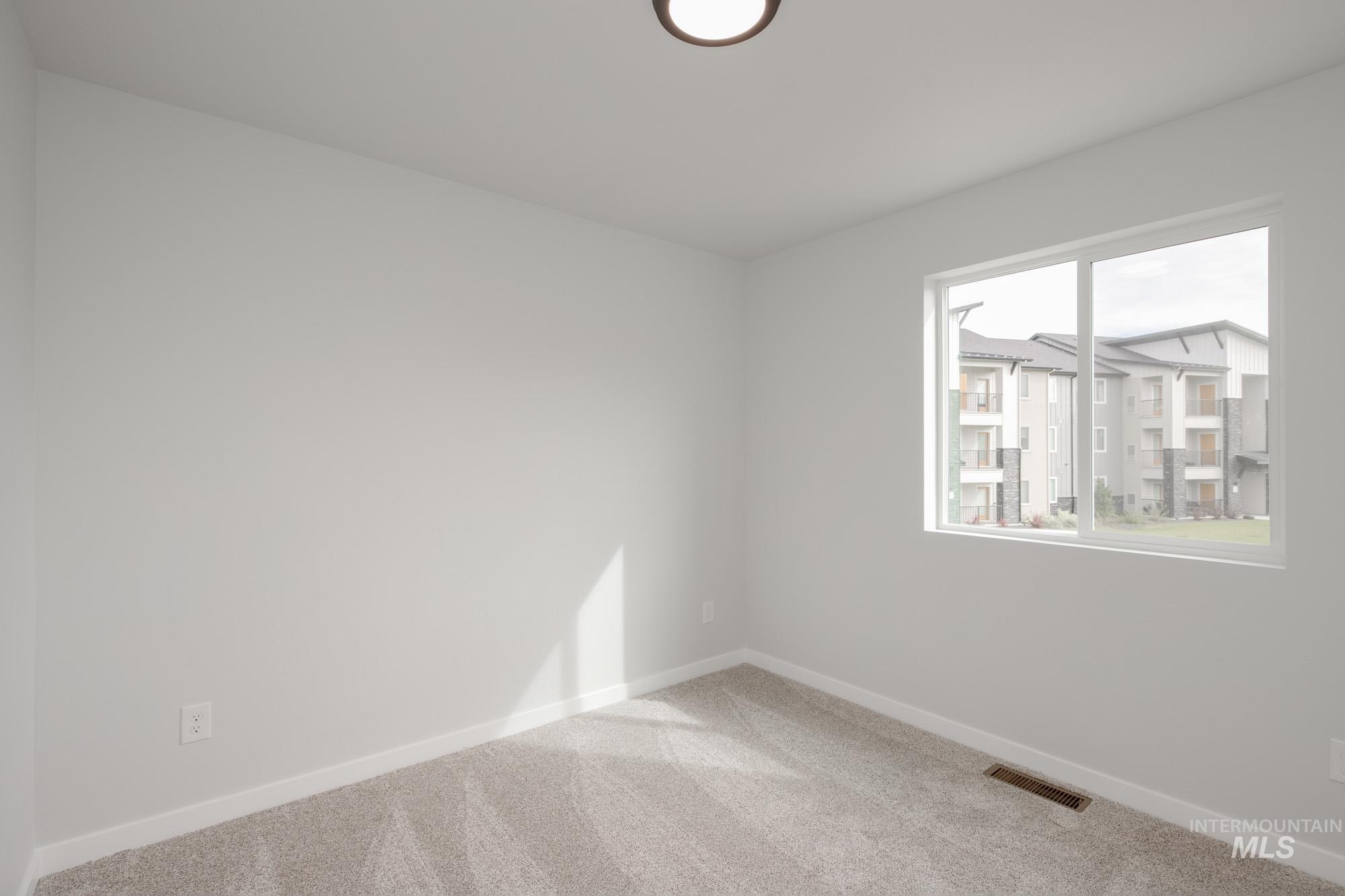 2192 South Border Way Meridian, ID 83642 - Photo 13 of 22 Carpeted spare room with baseboards