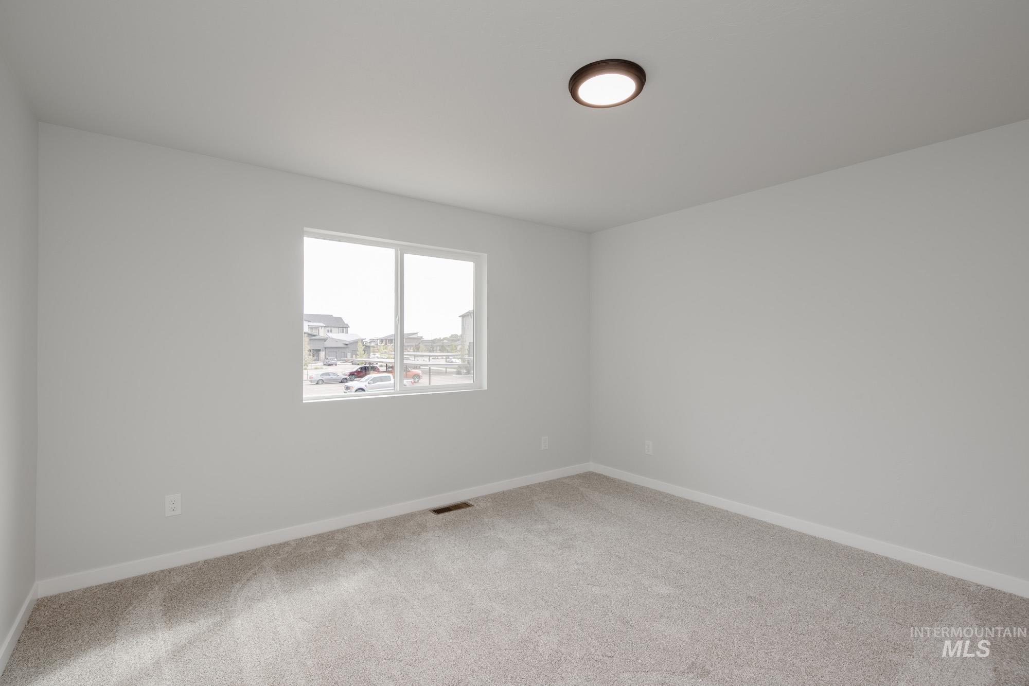 2192 South Border Way Meridian, ID 83642 - Photo 14 of 22 Unfurnished room featuring carpet flooring and baseboards