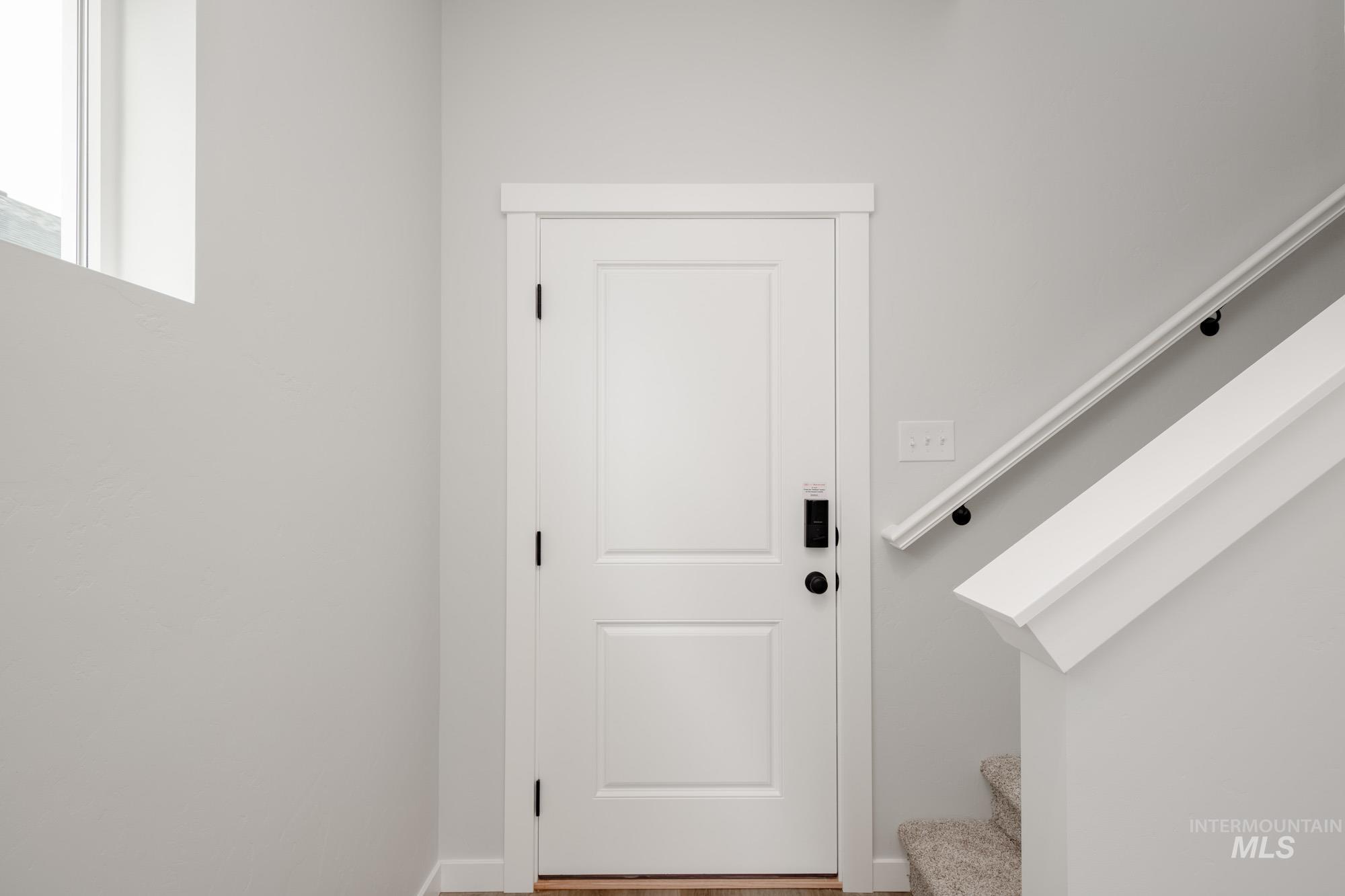 2192 South Border Way Meridian, ID 83642 - Photo 2 of 22 Doorway to outside featuring stairway and baseboards