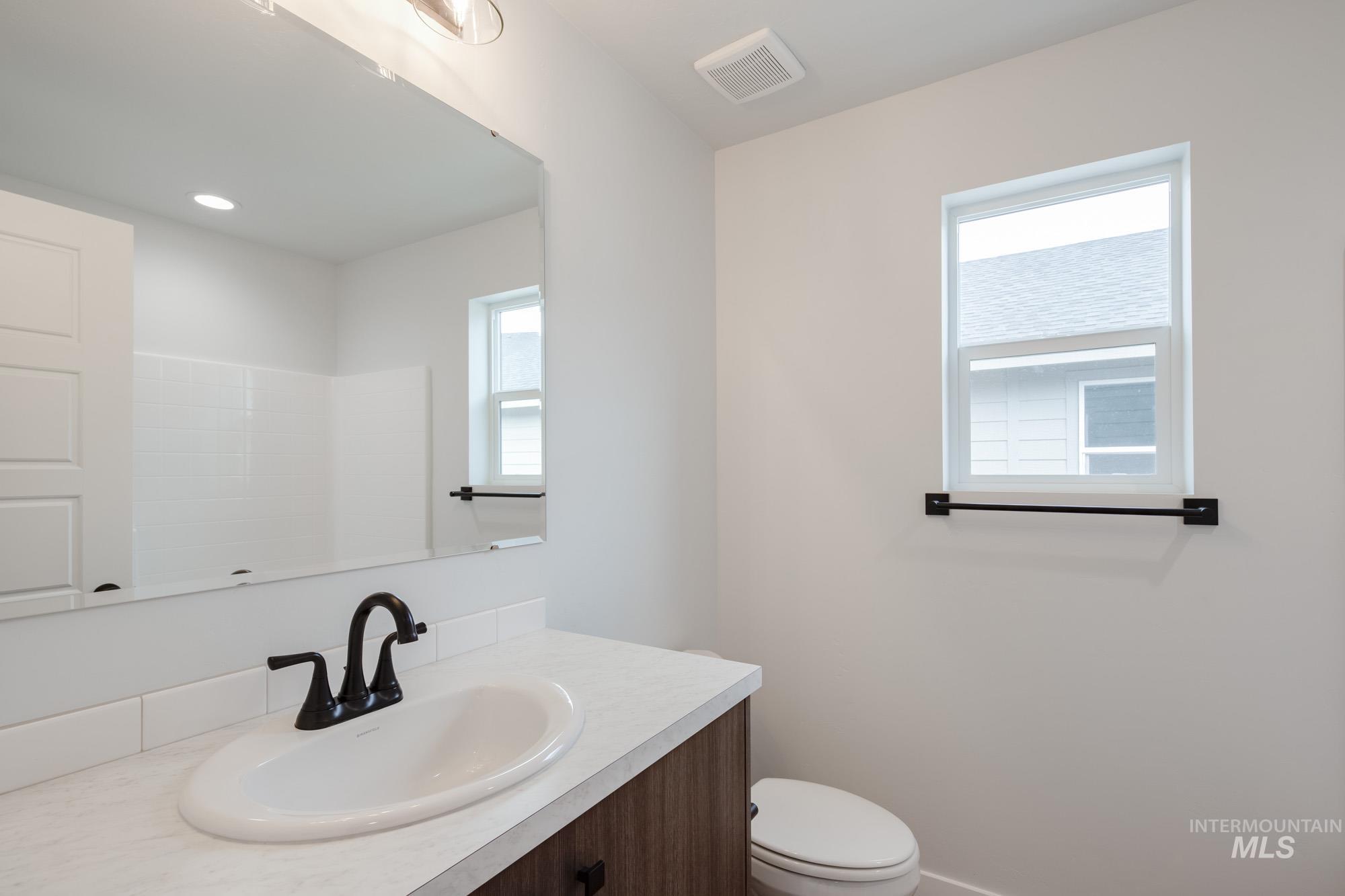 2192 South Border Way Meridian, ID 83642 - Photo 18 of 22 Bathroom featuring vanity and toilet