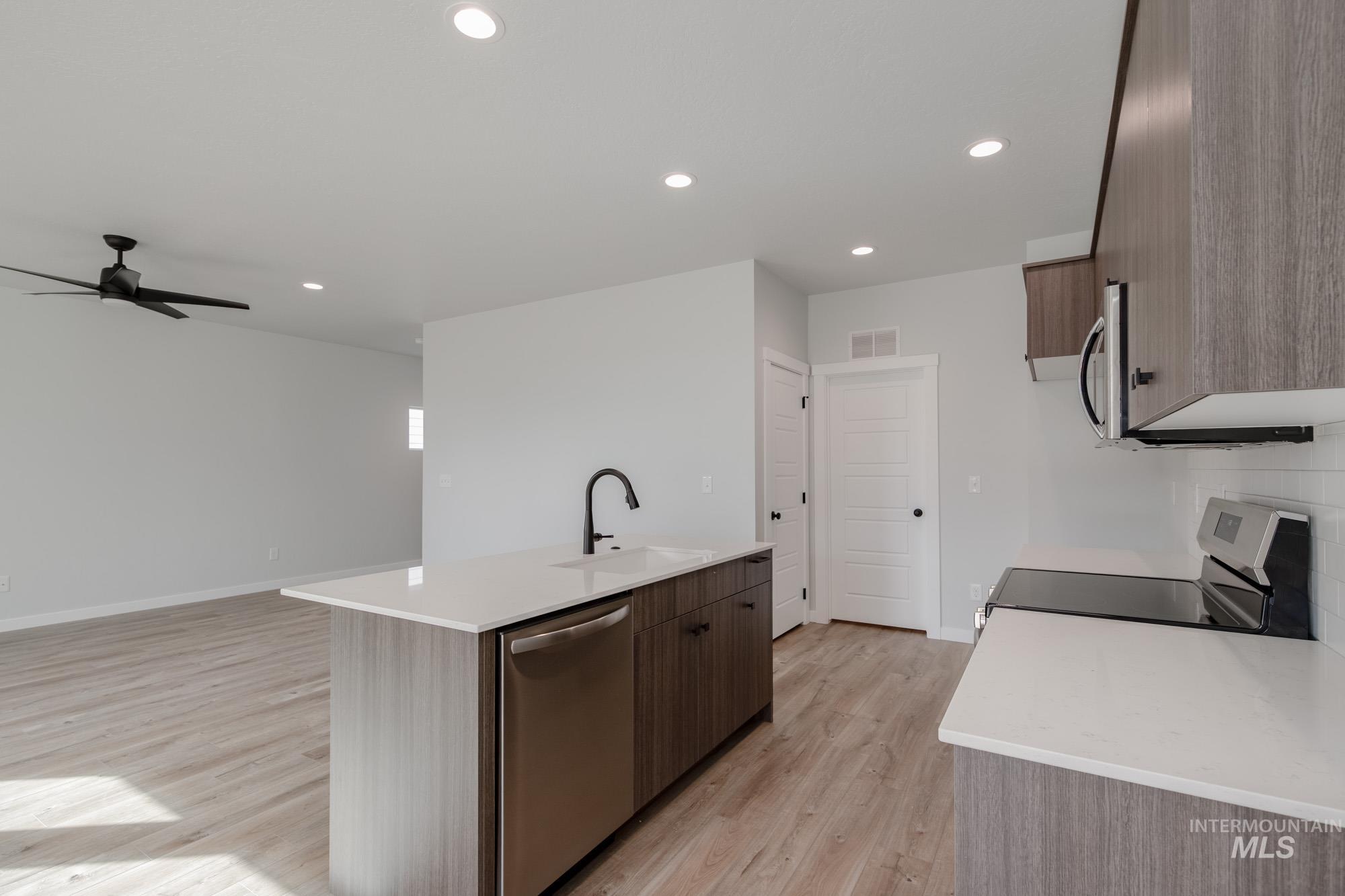 2192 South Border Way Meridian, ID 83642 - Photo 5 of 22 Kitchen with stainless steel appliances, light stone counters, modern cabinets, and recessed lighting