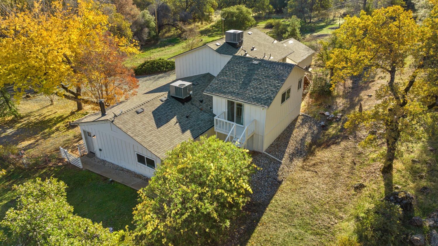 16153 Indian Springs Road Penn Valley, CA 95946 - Photo 15 of 64 a aerial view of a house with a yard and large trees