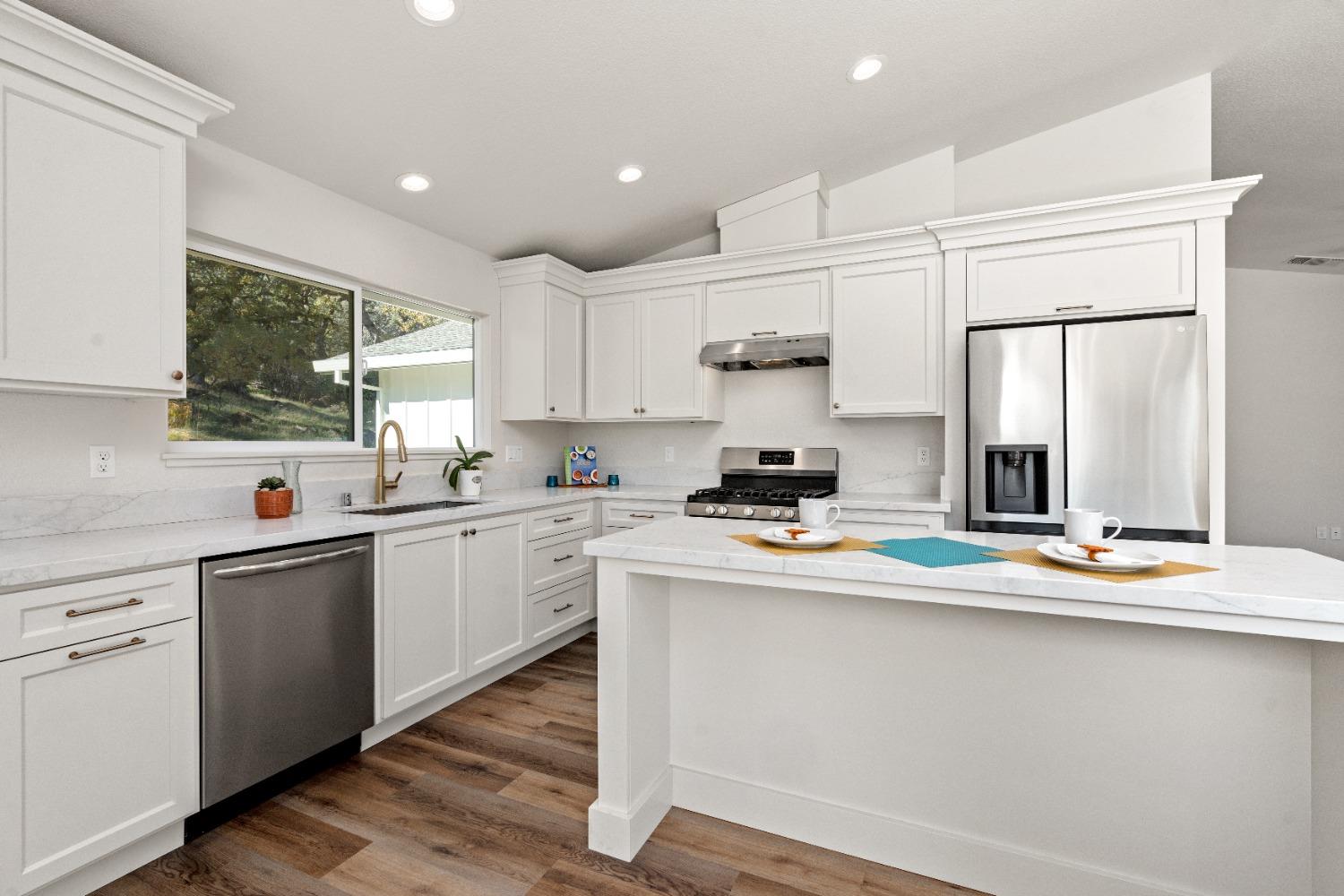 16153 Indian Springs Road Penn Valley, CA 95946 - Photo 31 of 64 a kitchen with appliances a sink and cabinets