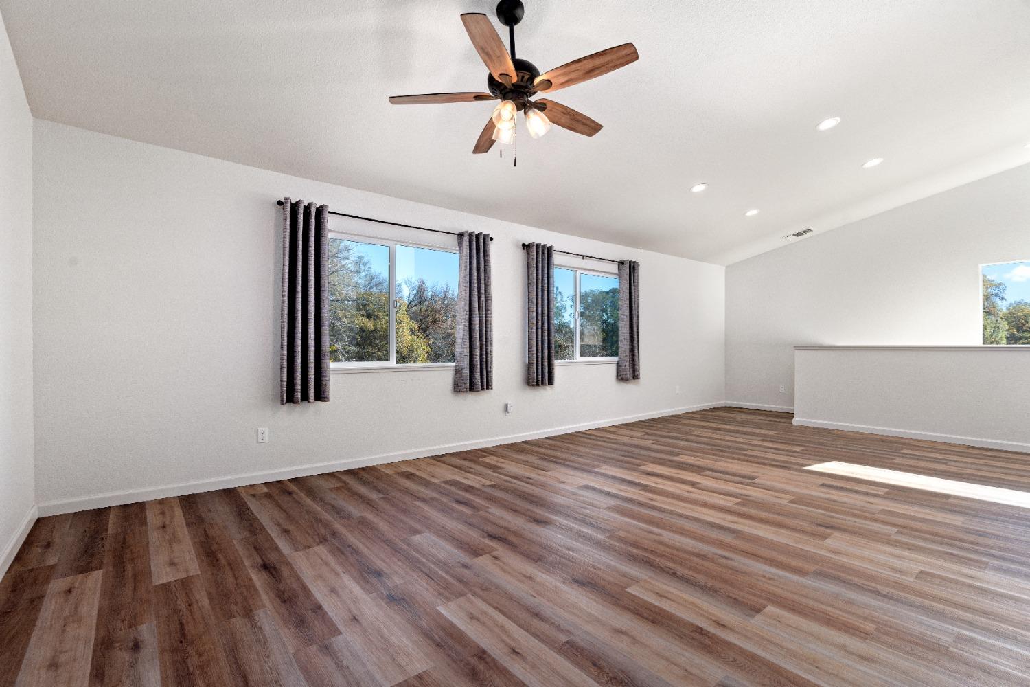 16153 Indian Springs Road Penn Valley, CA 95946 - Photo 38 of 64 a view of an empty room with a window and wooden floor