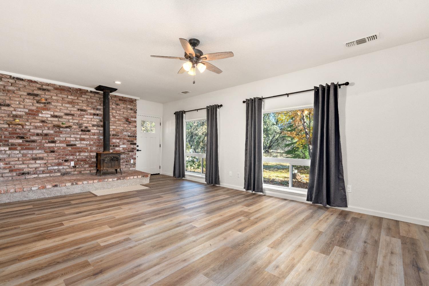 16153 Indian Springs Road Penn Valley, CA 95946 - Photo 54 of 64 a view of an empty room with a window and wooden floor