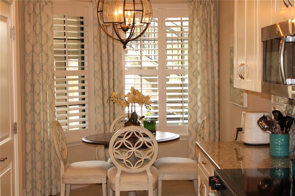 13711 Messina Loop, Unit 104 Bradenton, FL 34211 - Photo 14 of 70 a view of a dining room with furniture window and outside view