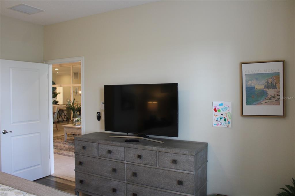 13711 Messina Loop, Unit 104 Bradenton, FL 34211 - Photo 18 of 70 a living room with furniture and flat screen tv