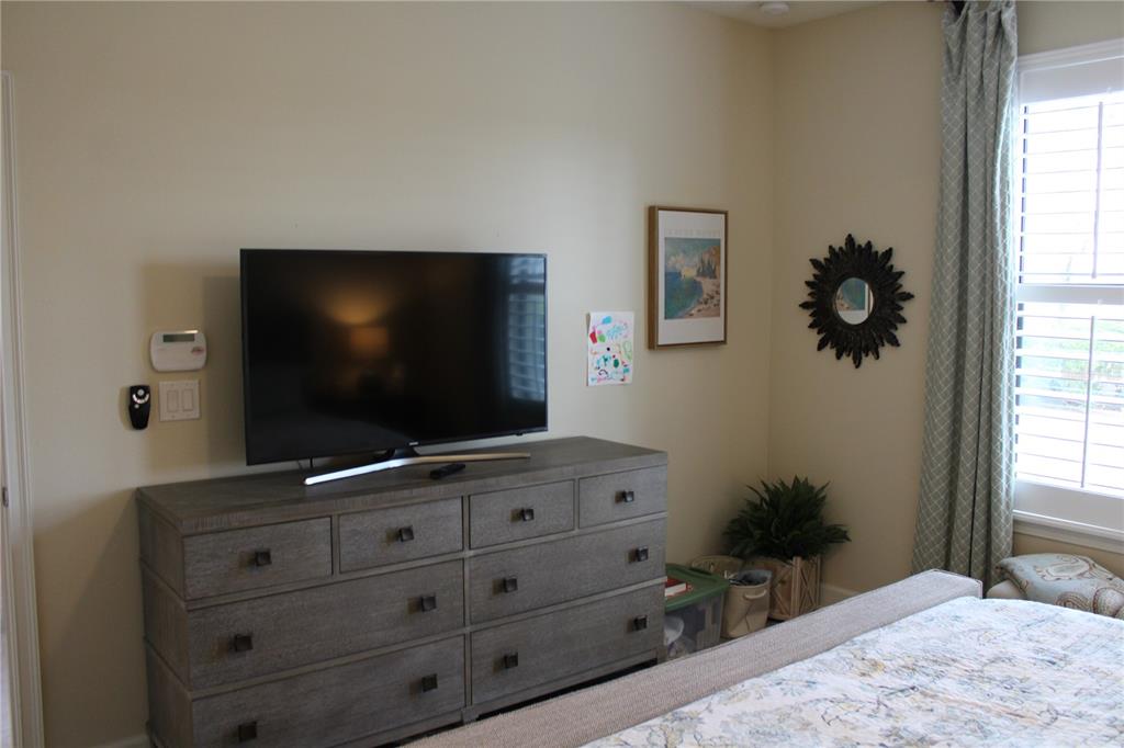 13711 Messina Loop, Unit 104 Bradenton, FL 34211 - Photo 19 of 70 a living room with furniture and a flat screen tv