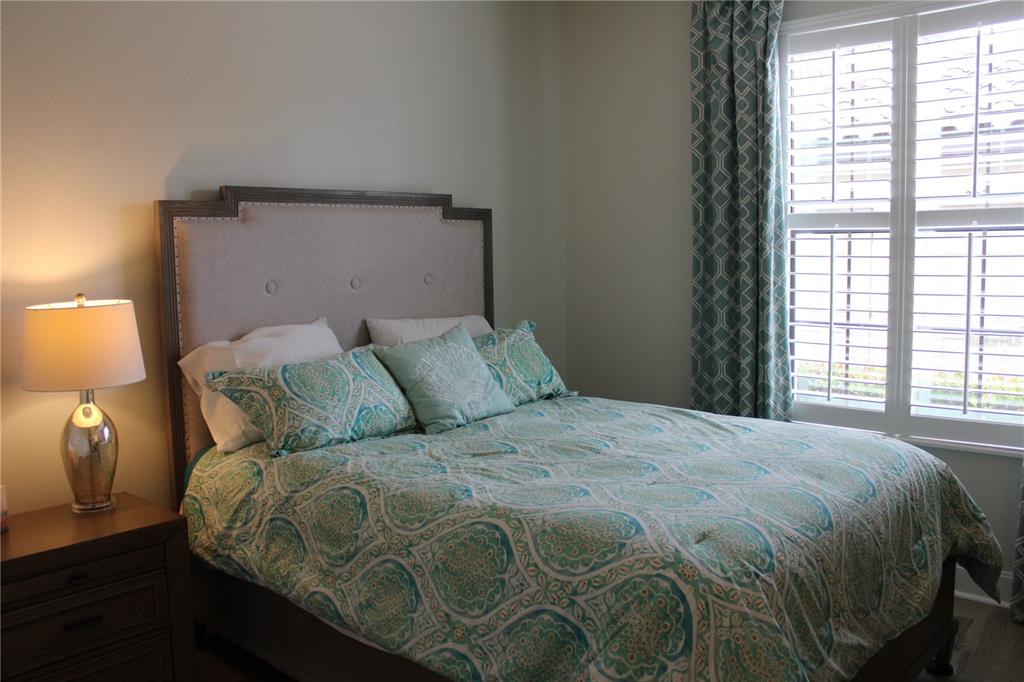 13711 Messina Loop, Unit 104 Bradenton, FL 34211 - Photo 24 of 70 a large bed sitting in a bedroom next to a window