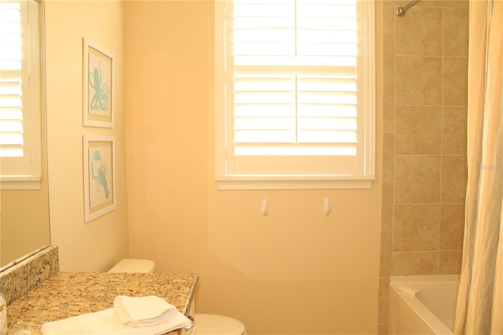 13711 Messina Loop, Unit 104 Bradenton, FL 34211 - Photo 33 of 70 a bathroom with a sink and a toilet